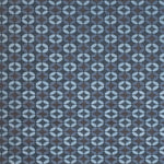 Petite Alhambra Rug featuring a pattern of linked circles that create a star like lattice in a range of blue shades, from pale blue to chambray, indigo, to dark navy