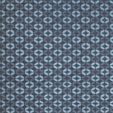 Petite Alhambra Rug featuring a pattern of linked circles that create a star like lattice in a range of blue shades, from pale blue to chambray, indigo, to dark navy