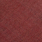 Detail of the Plain Stitched Border Rug in Carmine, a solid red rug with a black border with black border with pink and taupe dashes. 