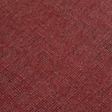 Detail of the Plain Stitched Border Rug in Carmine, a solid red rug with a black border with black border with pink and taupe dashes. 