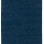 Full Size Plain Stitched Border Rug in Prussian Blue, a solid indigo rug with a black border with black border with blue and taupe dashes. 