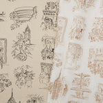 Two overlapping linen swatches in different colorways of the same hand-drawn New York City landmarks pattern.