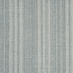 Wool broadloom carpet swatch in a light blue colorway mottled with gray and blue fibers.