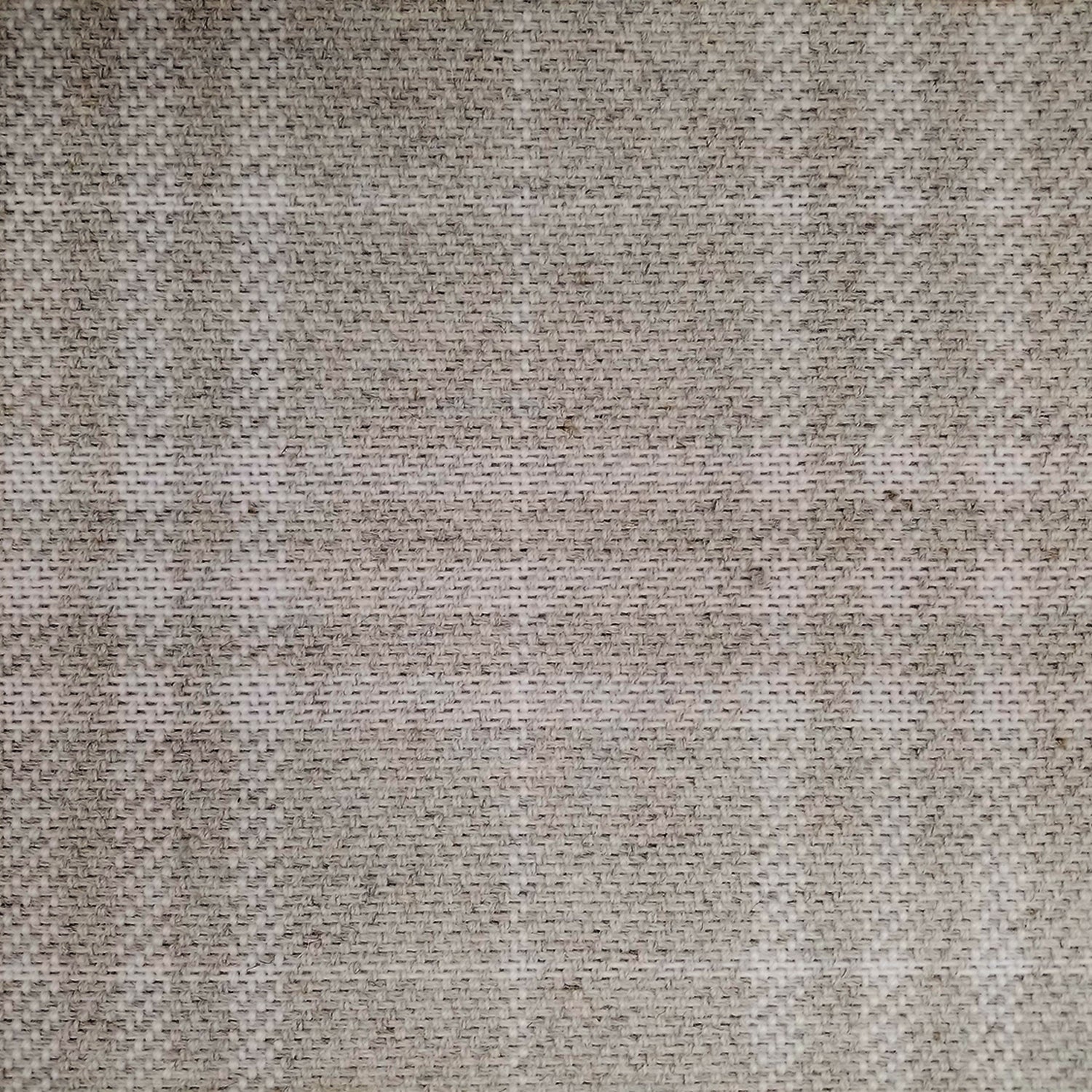 Wool broadloom carpet swatch in a subtle tan and cream plaid pattern.