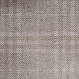 Wool broadloom carpet swatch in a subtle tan and cream plaid pattern.