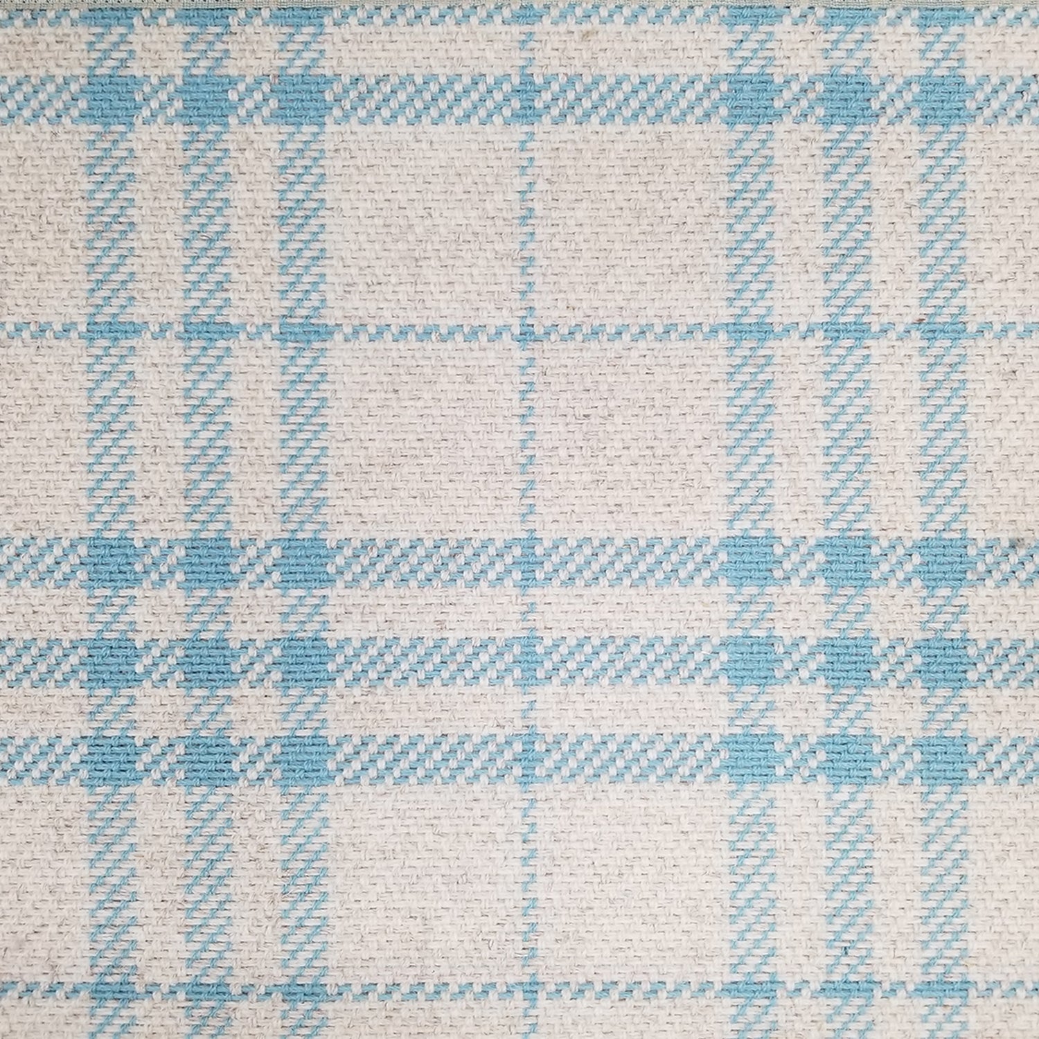 Wool broadloom carpet swatch in a blue and tan plaid pattern.