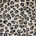 Wool broadloom carpet swatch in a leopard print in black and brown on a mottled cream field.