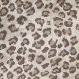 Wool broadloom carpet swatch in a leopard print in tan and brown on a mottled cream field.