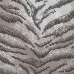 Wool broadloom carpet swatch in a tiger print in tan and brown on a mottled cream field.