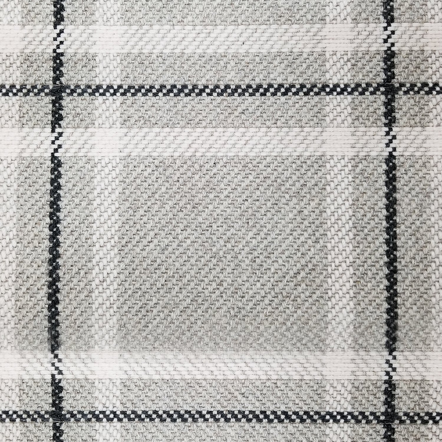 Wool broadloom carpet swatch in a plaid print in shades of cream, gray and black.