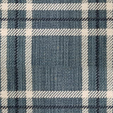 Wool broadloom carpet swatch in a plaid print in shades of tan, navy and black.