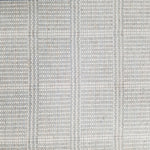 Wool broadloom carpet swatch in a plaid print in shades of light blue, gray and cream.