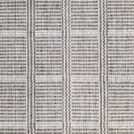 Wool broadloom carpet swatch in a plaid print in shades of gray and white.