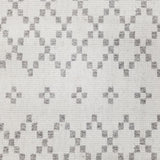 Wool broadloom carpet swatch in a repeating diamond print in light gray on an ivory field.