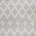 Wool broadloom carpet swatch in a repeating diamond print in cream on a silver field.