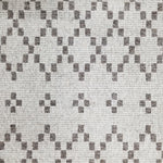 Wool broadloom carpet swatch in a repeating diamond print in dark gray on a silver field.
