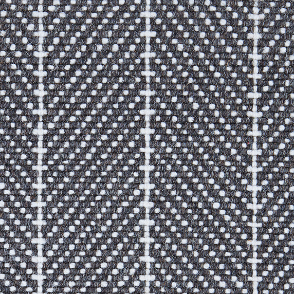 Wool broadloom carpet swatch in a woven chevron pattern in charcoal and white with white accent stripes.