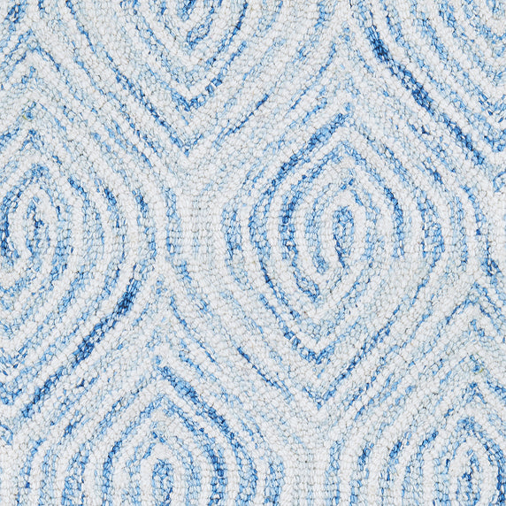 Wool broadloom carpet swatch in a painterly diamond pattern in white and blue.