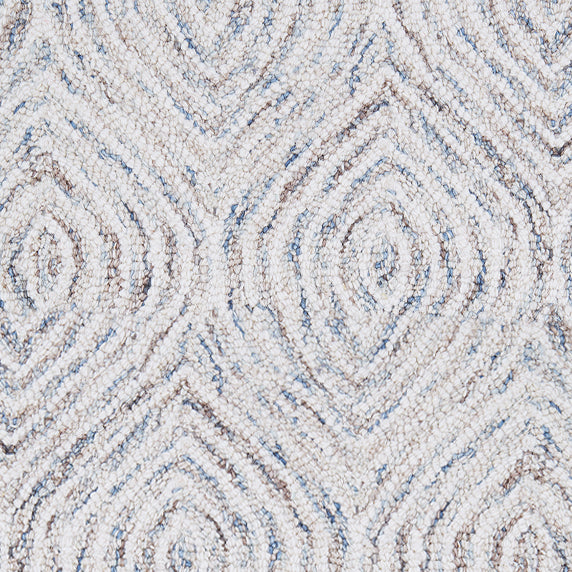 Wool broadloom carpet swatch in a painterly diamond pattern in cream, blue and brown.