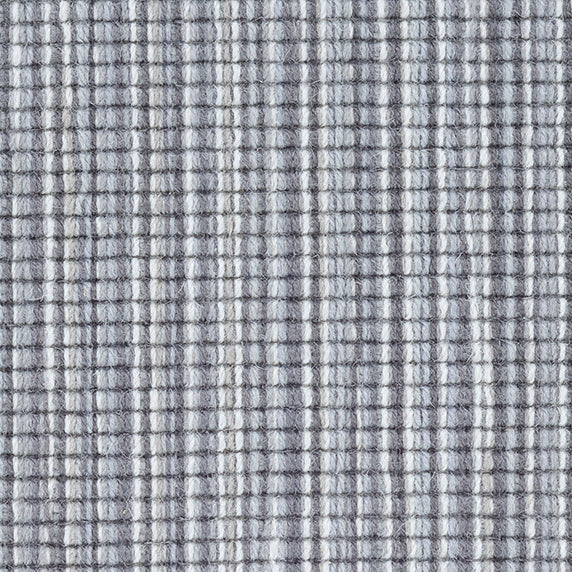 Wool broadloom carpet swatch in a multicolor stripe in shades of white, gray and blue.
