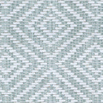 Wool broadloom carpet swatch in a woven geometric diamond print in teal and cream.