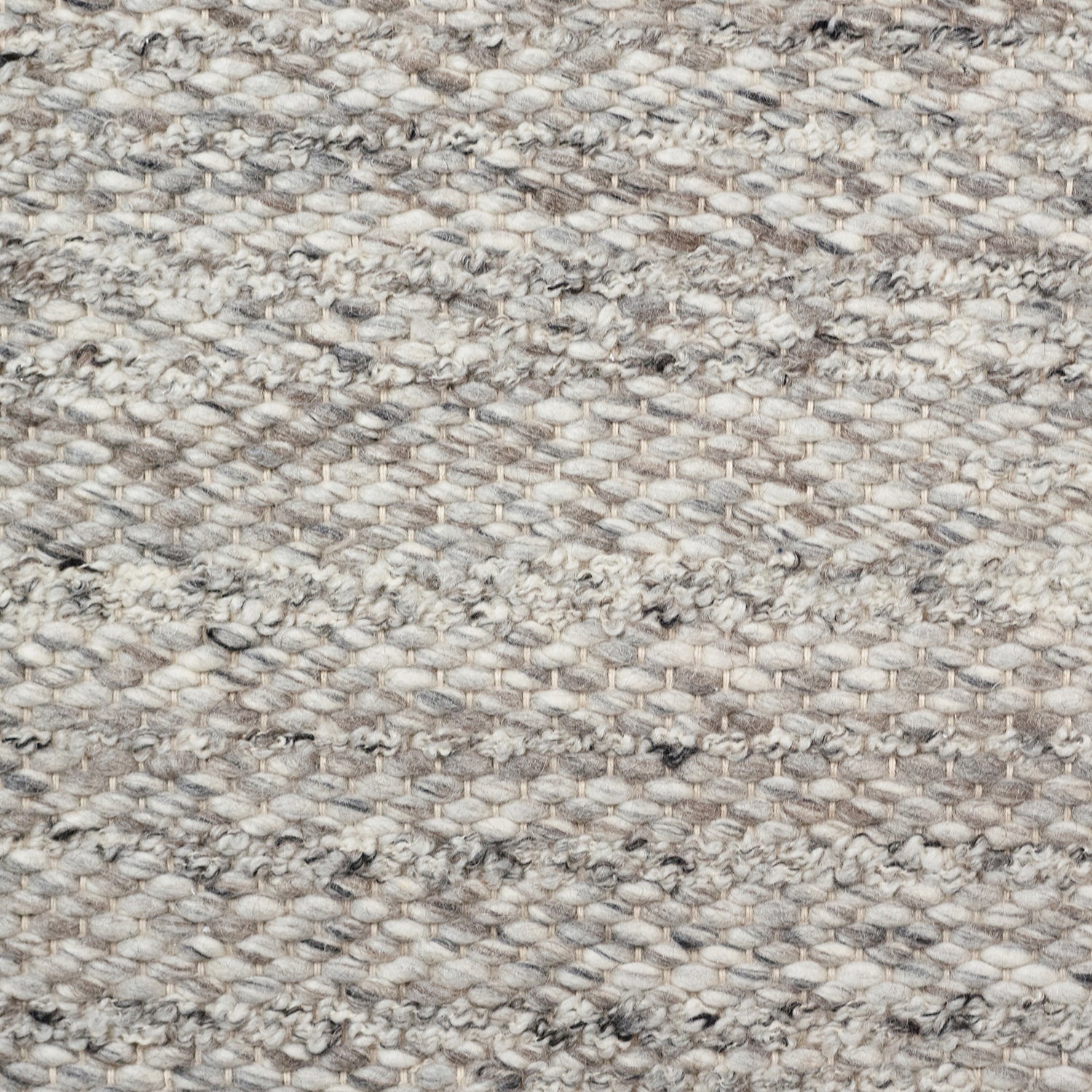 Wool broadloom carpet swatch in a textured stripe weave in mottled gray.
