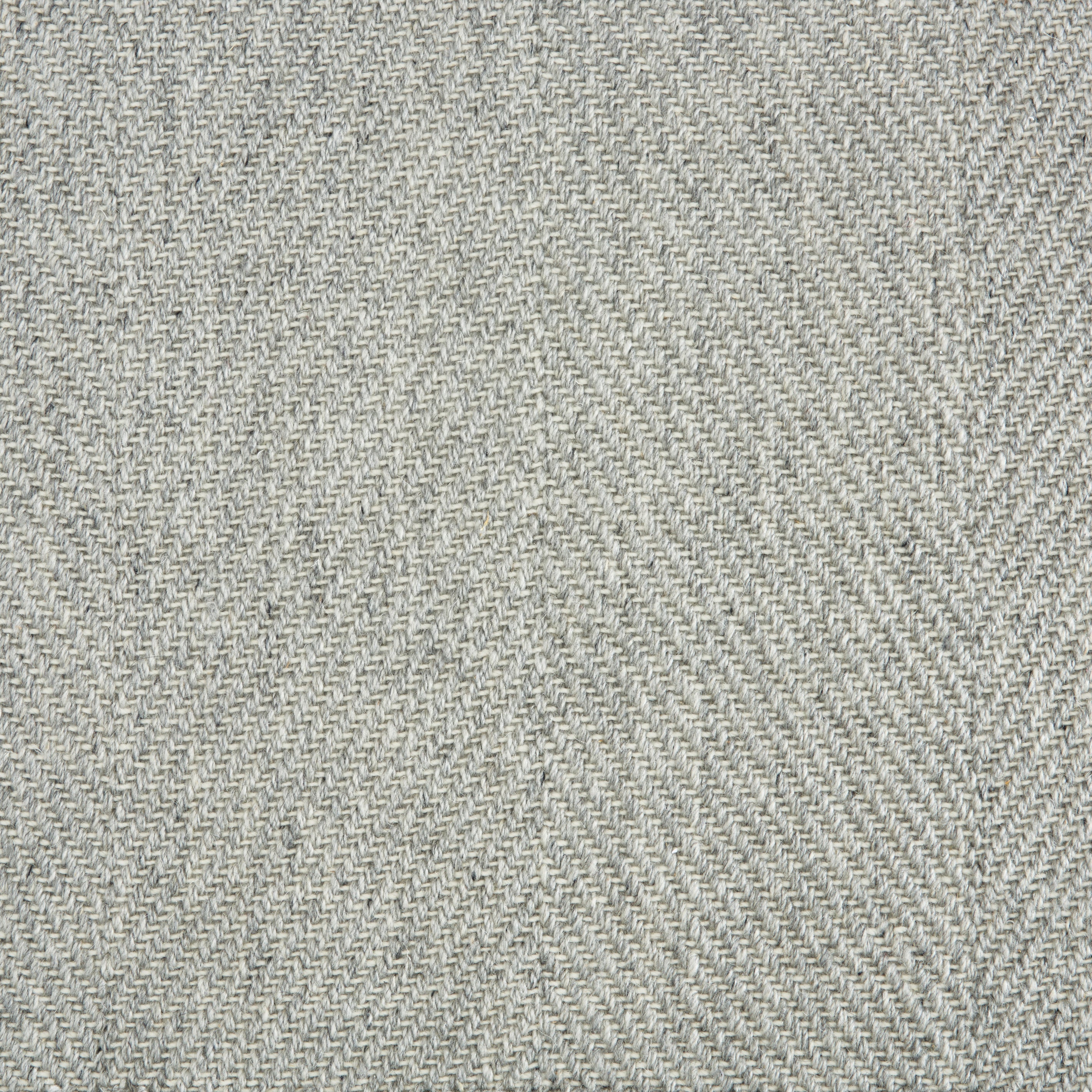 Wool-blend broadloom carpet swatch in a flat herringbone weave in mottled green-gray.