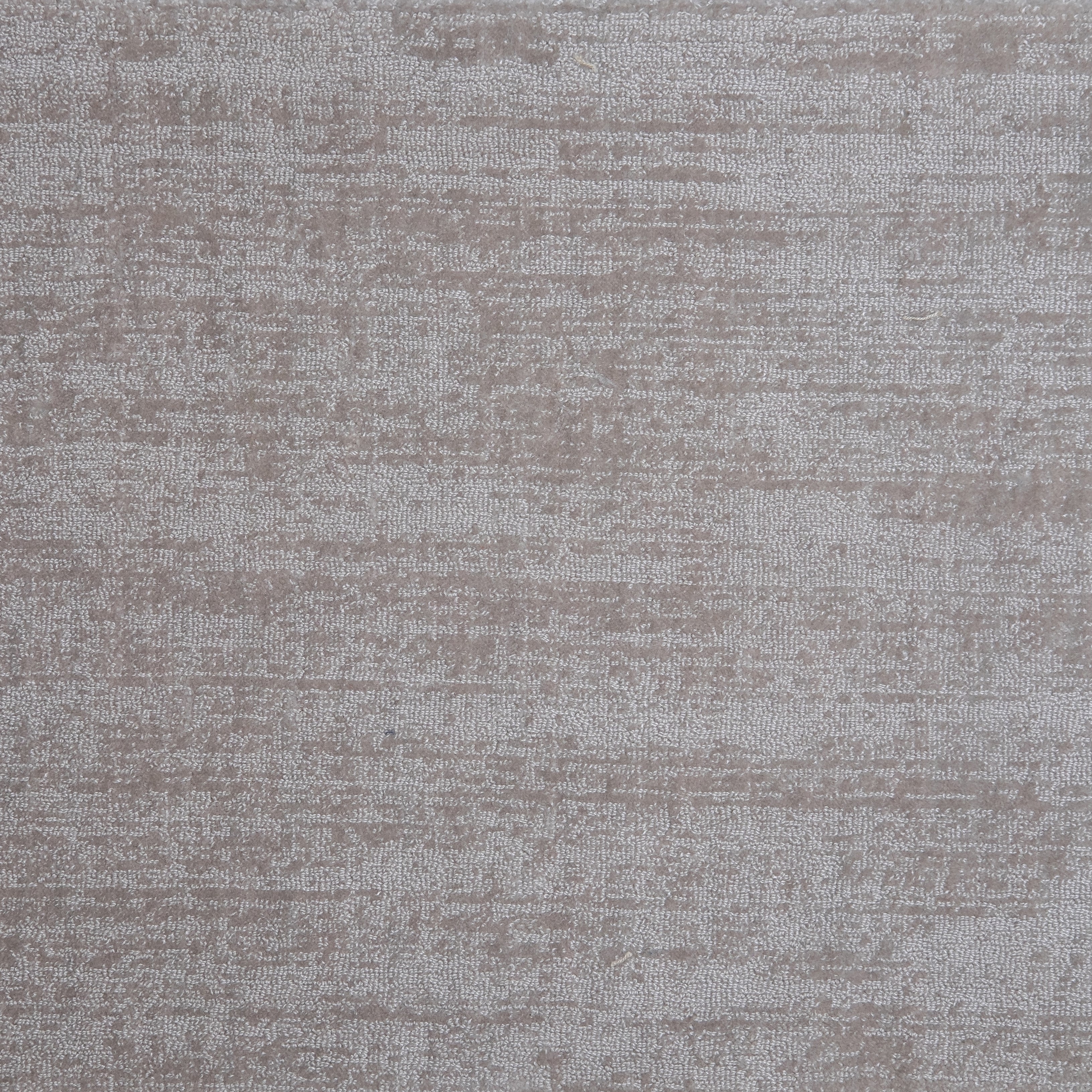 Nylon broadloom carpet swatch in a textured weave in iridescent brown.