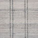 Wool-blend broadloom carpet swatch in a plaid tweed weave in cream and silver.