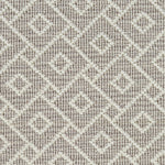 Wool broadloom carpet swatch in an interlocking geometric print in white and light gray.