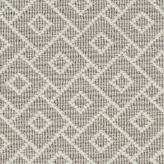 Wool broadloom carpet swatch in an interlocking geometric print in white and light gray.