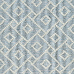 Wool broadloom carpet swatch in an interlocking geometric print in cream and light blue.
