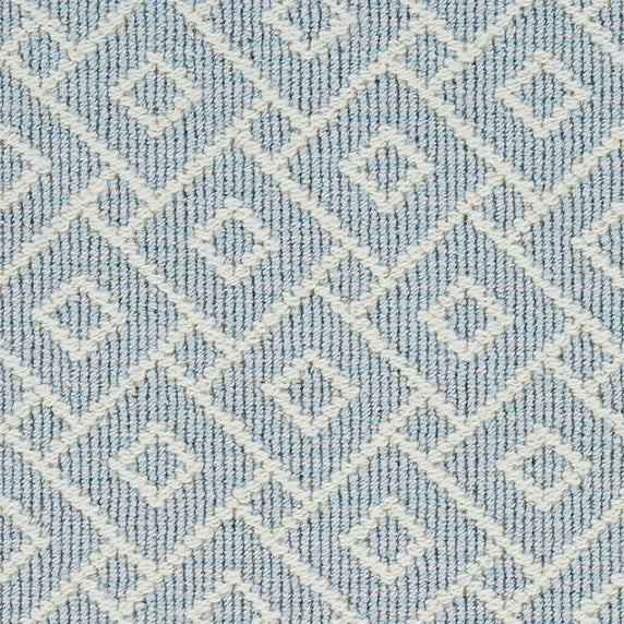 Wool broadloom carpet swatch in an interlocking geometric print in cream and light blue.