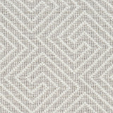 Wool broadloom carpet swatch in a high-pile interlocking geometric pattern in white and light brown.