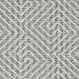 Wool broadloom carpet swatch in a high-pile interlocking geometric pattern in cream and gray.