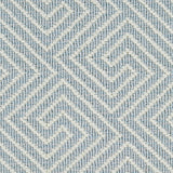 Wool broadloom carpet swatch in a high-pile interlocking geometric pattern in cream and light blue.