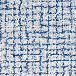Wool broadloom carpet swatch in a high-pile weave in mottled white, cream and blue.