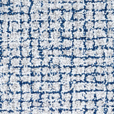 Wool broadloom carpet swatch in a high-pile weave in mottled white, cream and blue.
