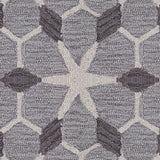 Wool broadloom carpet swatch in a geometric lattice pattern in cream and charcoal on a gray field.