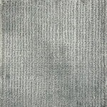 Nylon broadloom carpet swatch in a ribbed weave in grey.
