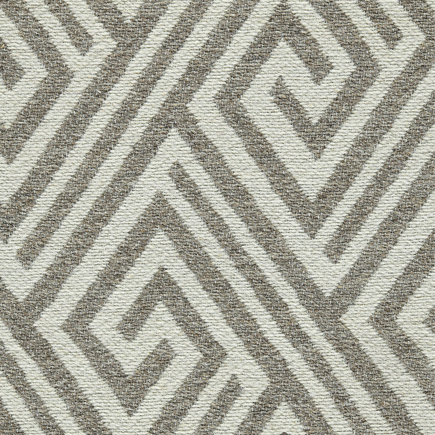 Wool-blend broadloom carpet swatch in an interlocking linear diamond pattern in cream and brown.