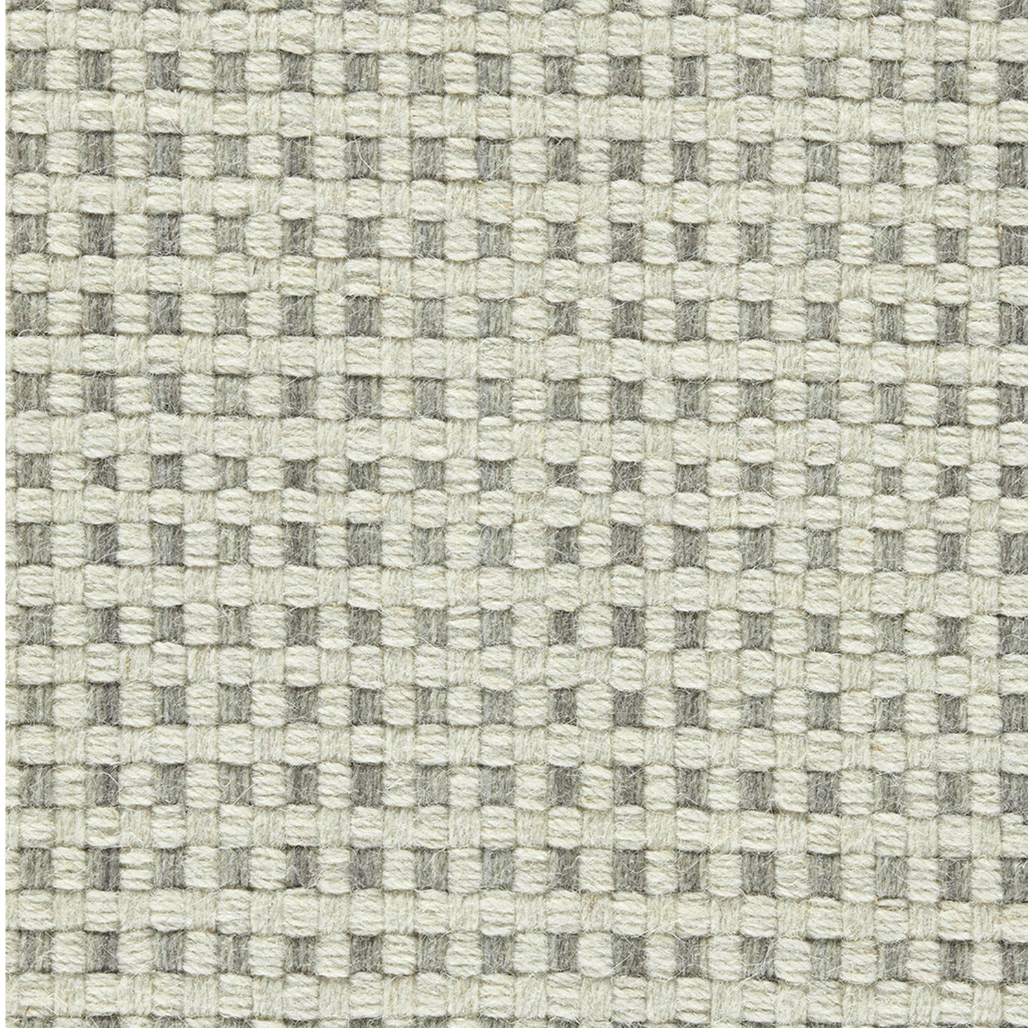 Wool broadloom carpet swatch in a flat grid weave in cream and gray.