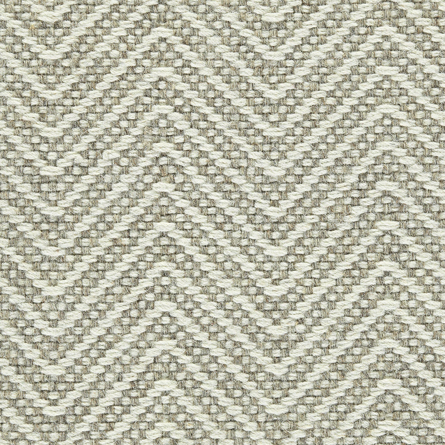 Wool broadloom carpet swatch in a chunky herringbone weave in brown and cream.