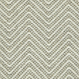 Wool broadloom carpet swatch in a chunky herringbone weave in brown and cream.