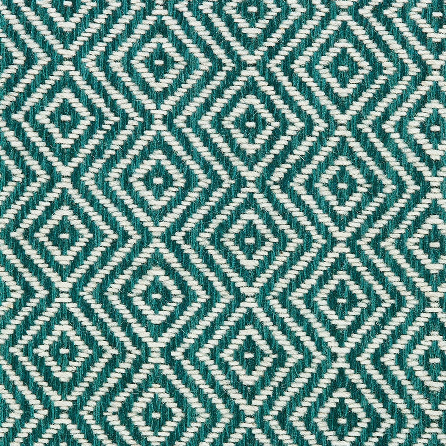 Wool broadloom carpet swatch in a diamond lattice weave in turquoise and white.