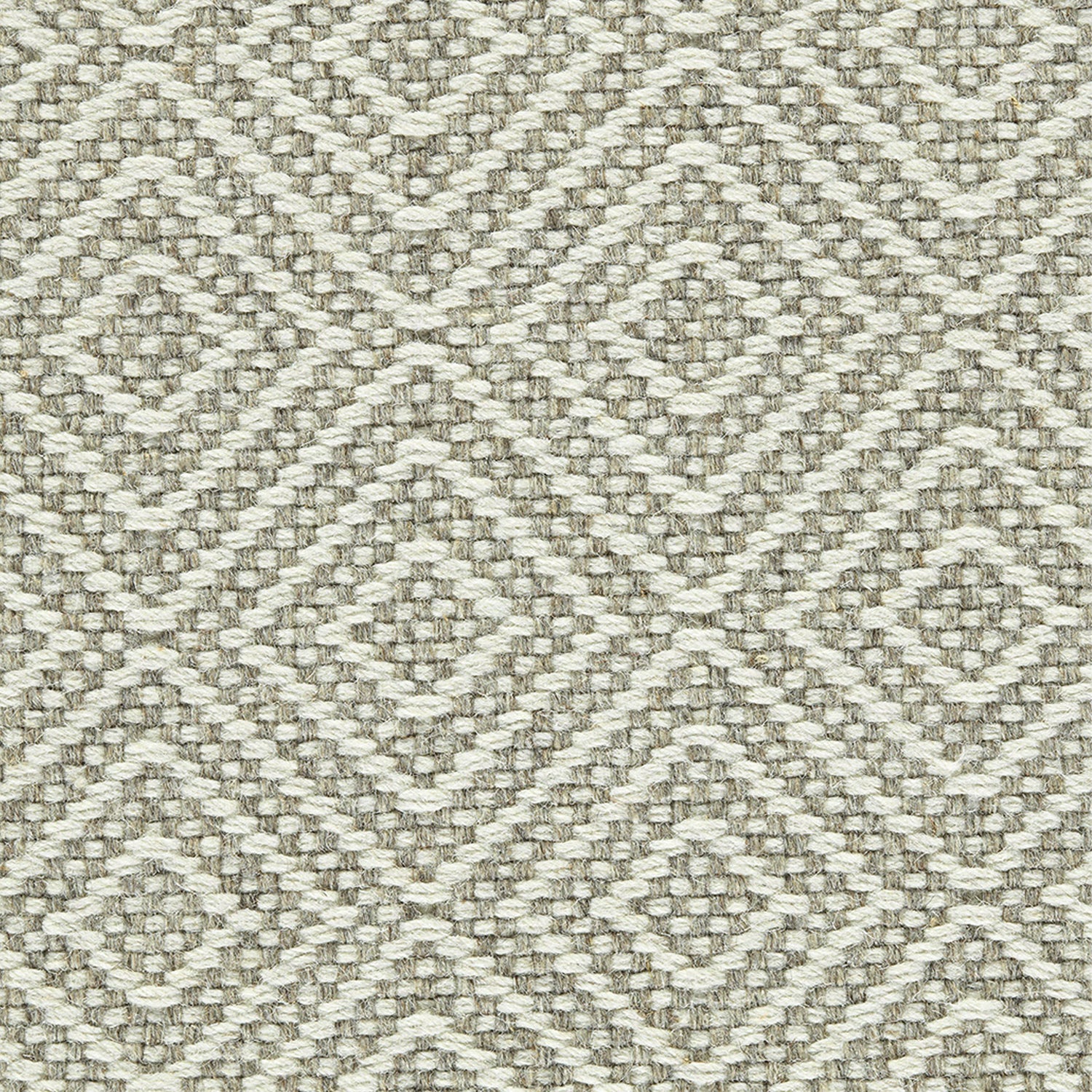 Wool broadloom carpet swatch in a chunky diamond lattice weave in cream and brown.