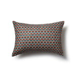 Rectangular throw pillow with a repeating Japanese-inspired scalloped pattern in shades of blue, red and cream.