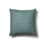 Square throw pillow with a repeating Japanese-inspired scalloped pattern in shades of blue, and cream.