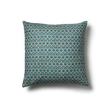 Square throw pillow with a repeating Japanese-inspired scalloped pattern in shades of blue, and cream.