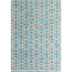 Large rectangular rug with an interlocking linear "gate" pattern in shades of white and gray on a sky-blue field.
